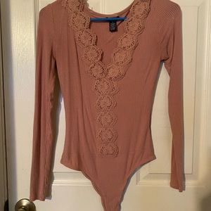 Super cute pink body suit!